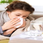 Flu or Cold. Sneezing Woman Sick Blowing Nose