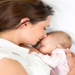 Happy Mother Breast Feeding Her Baby Infant