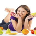 Healthy nutrition – young woman with fruits