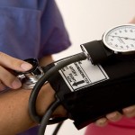 Doctor or nurse taking a patient’s blood pressure